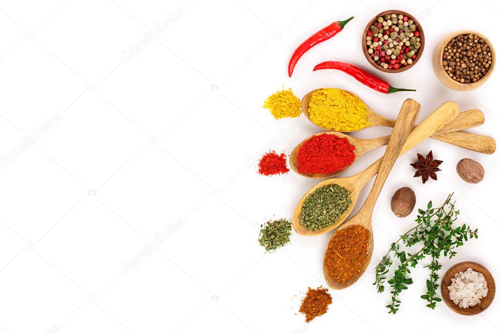 mix of spices in wooden spoon isolated on a white background with copy space for your text. Top view. Flat lay. Set or collection