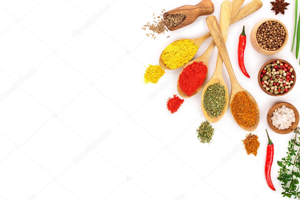 mix of spices in wooden spoon isolated on a white background with copy space for your text. Top view. Flat lay. Set or collection