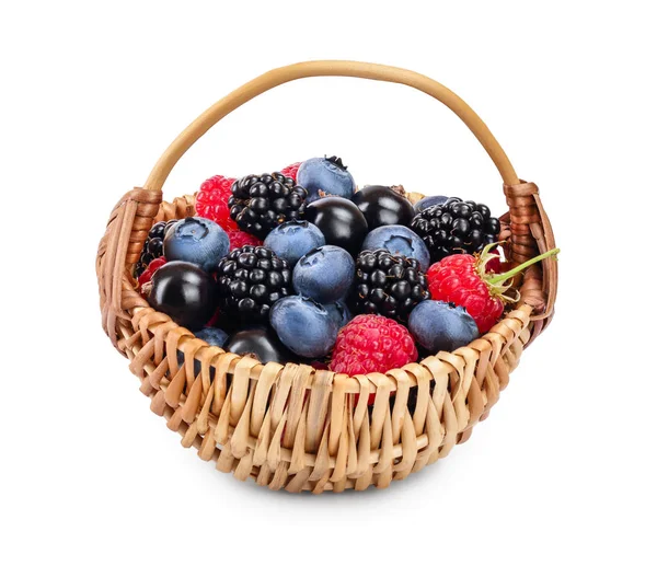 Mix of blackberry blueberry raspberry black currant in wicker basket isolated on white background. — Stock Photo, Image