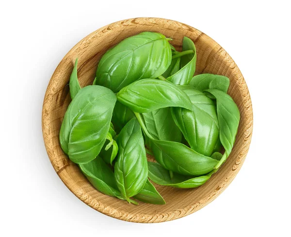 Fresh basil leaf in wooden bowl isolated on white background with clipping path and full depth of field. Top view. Flat lay — Stockfoto