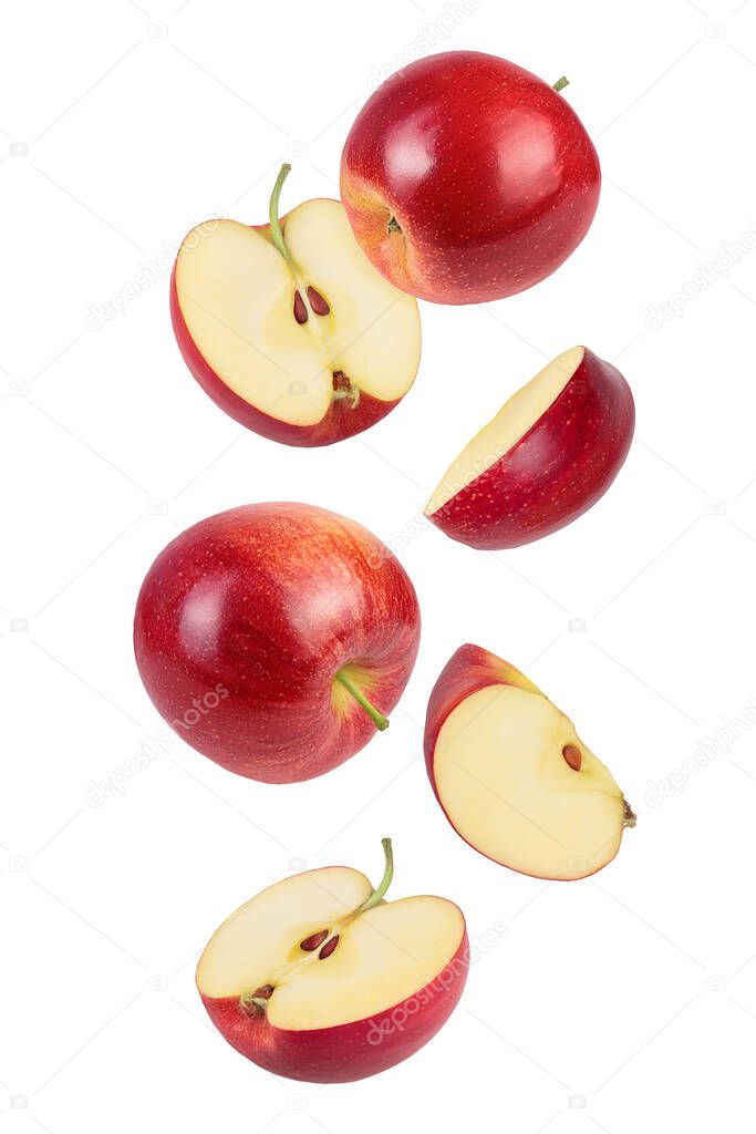 falling Red apple slices isolated on white background,