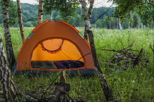 orange tent in nature landscape summer environment