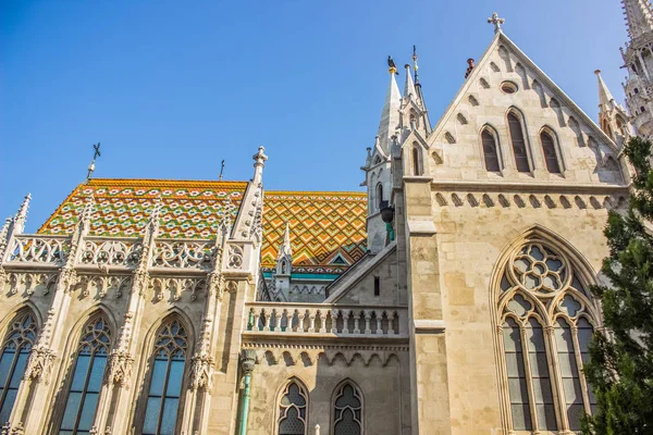 white gothic church with towers on blue sky background in summer time bright colorful day