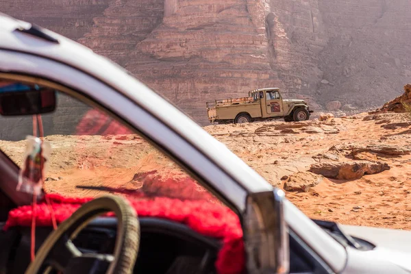 SUV car in desert dry rocky country side scenic landscape