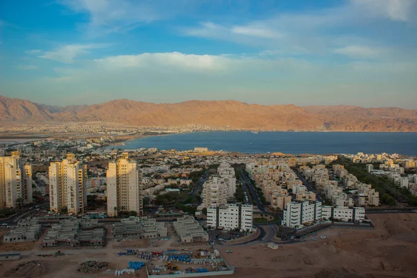 top view aerial photography of the most south Israeli city Eilat near Gulf of Aqaba Red sea bay with Jordanian desert and mountain background