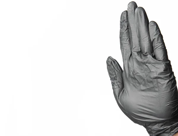 Sarung Tangan Hitam Lateks Berhenti Tanda Tangan Pada Isolasi Latar — Stok Foto