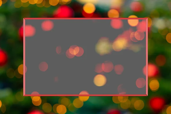 Christmas poster copy space pattern frame on unfocused garland illumination bokeh background colorful glare and lights