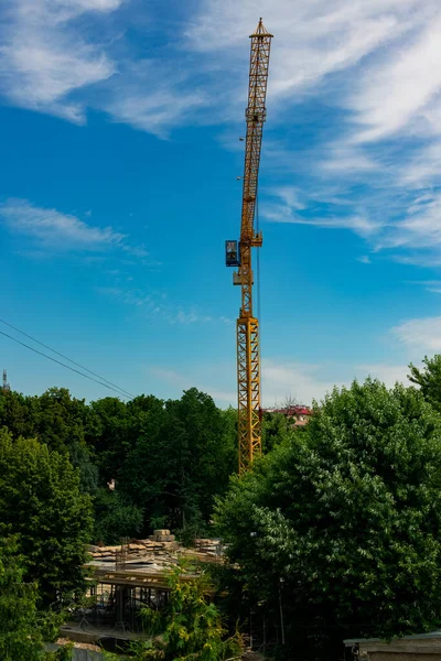 construction crane landmark object vertical picture in clear weather summer day time