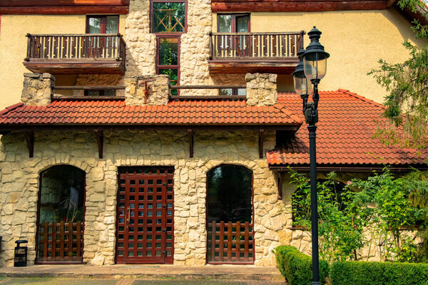 medieval palace hotel outdoor exterior facade side with entrance door and street lantern foreground space