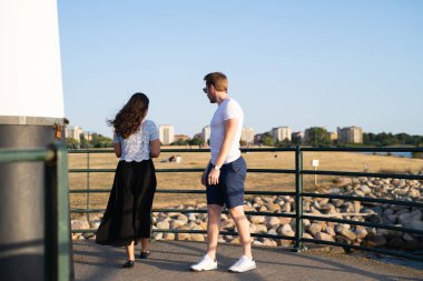 Couple on pier in summer 
