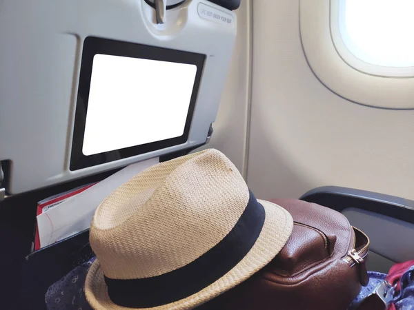 Exhibición en blanco de la bandera delante del asiento del pasajero para la publicidad business.Travel publicidad en aviones para la plantilla del pasajero . —  Fotos de Stock