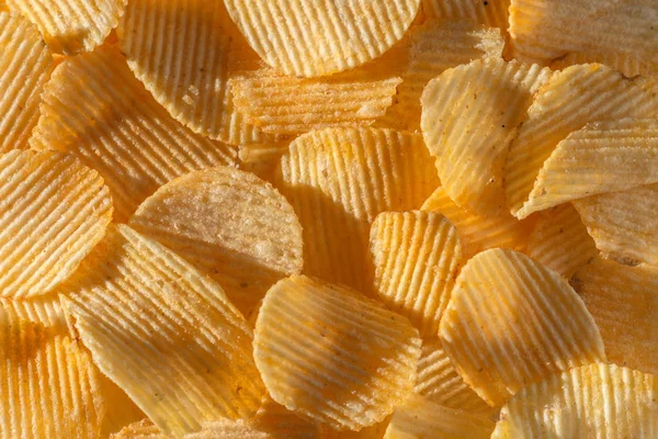 Close Lot Tasty Rippled Yellow Potato Chips Background — Stock Photo, Image