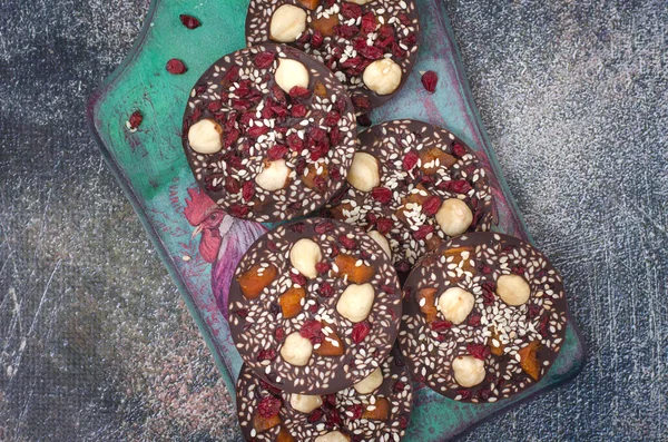 Homemade chocolate with hazelnuts barberry and dried apricots