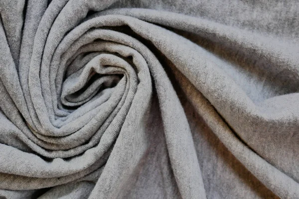 Latar belakang tekstil abstrak. Gelombang tekstur kain dalam bentuk spiral . — Stok Foto