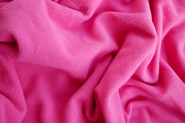 Latar belakang gelombang warna merah muda kain woolen . — Stok Foto