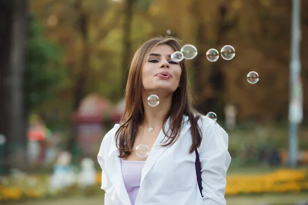 Happy Adult Girl Blowing Bubbles — Stock Photo, Image