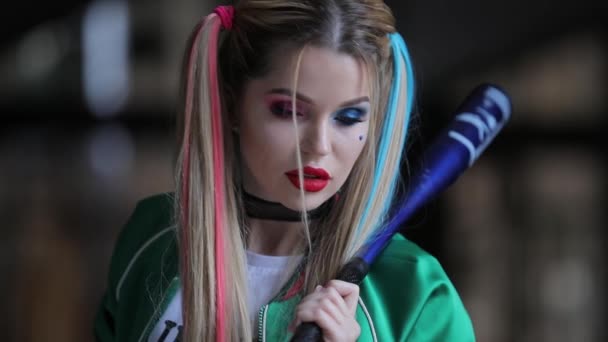 Unusual woman with fantastic makeup and unconventional hairstyle holding baseball-bat — Stock Video