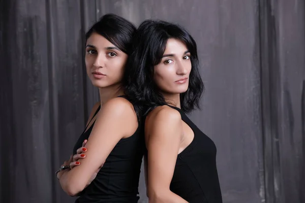 Two sisters studio portrait