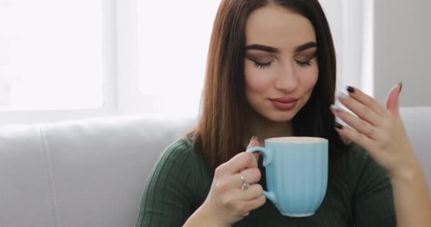 Woman drinking tea at home — Stock Video