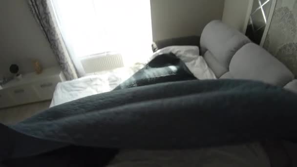 First person view, man making the bed at morning — Stock Video