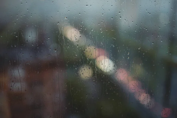 Raindrops, rain behind the window, background