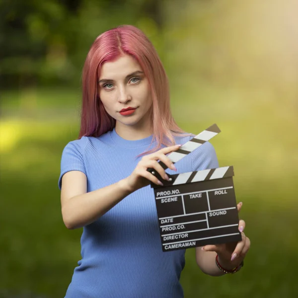 Assistant of director holding movie flapper — Stock Photo, Image