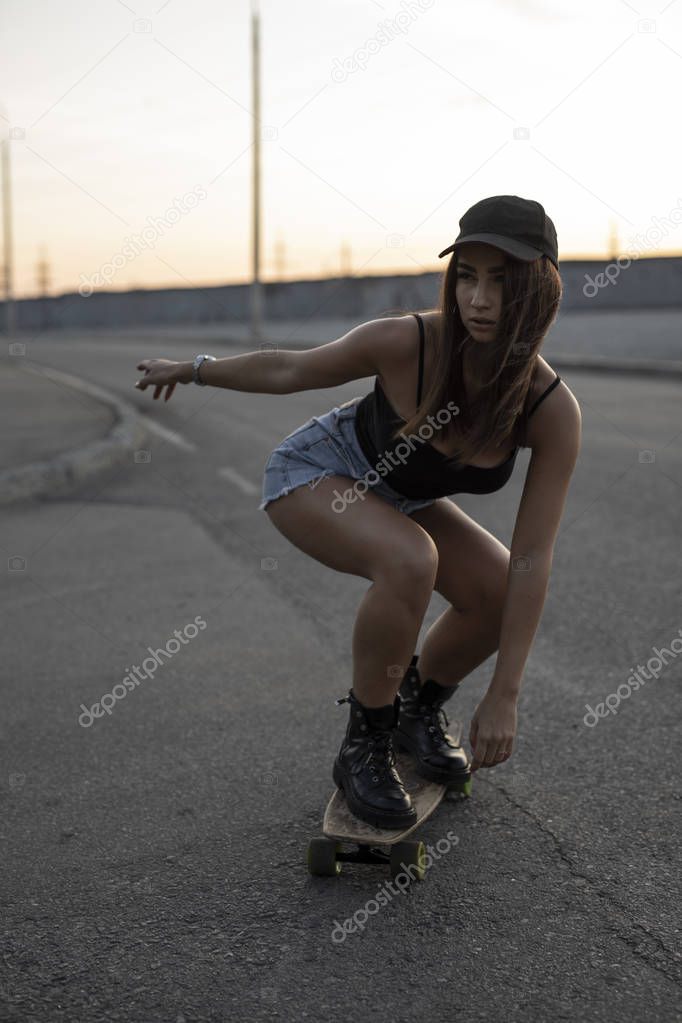 Woman skateboarder riding her skate on a road