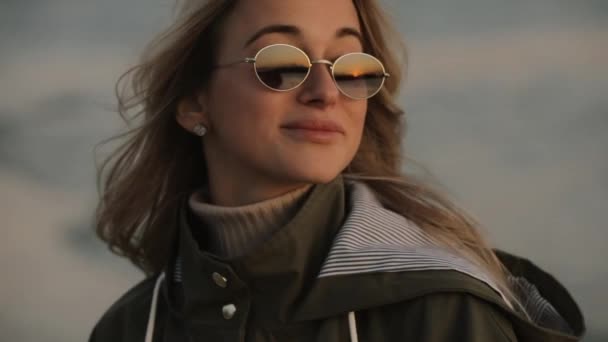 Stylish happy woman in sunglasses laughing standing at the river — Stock Video