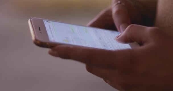 Close up of woman hands texting writing messages on a smartphone — 图库视频影像