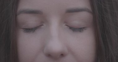 Female eyes before and after colour correction and retouch, closeup