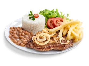 Pirinçli, fasulyeli, salatalı, patates kızartmalı özel bir biftek tabağı.