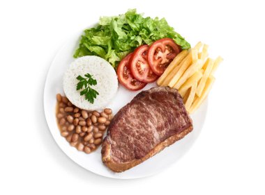 Pirinç, fasulye, salata, patates kızartması ile birlikte fileto fileto özel yemeği.