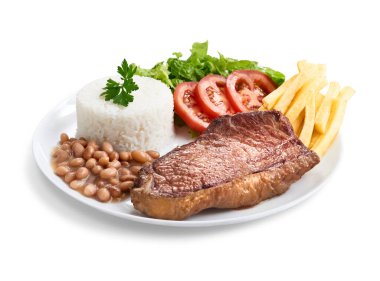 Pirinç, fasulye, salata ve patates kızartmalı Contra fileto, aşağıdan manzara.