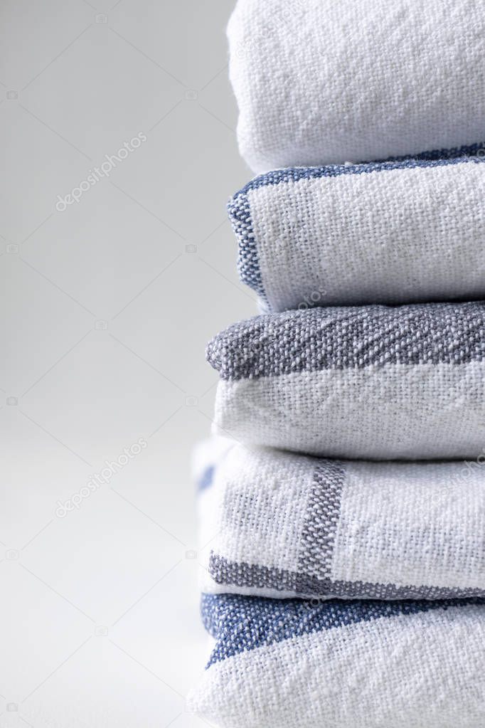 Vertical stack of kitchen towels folded