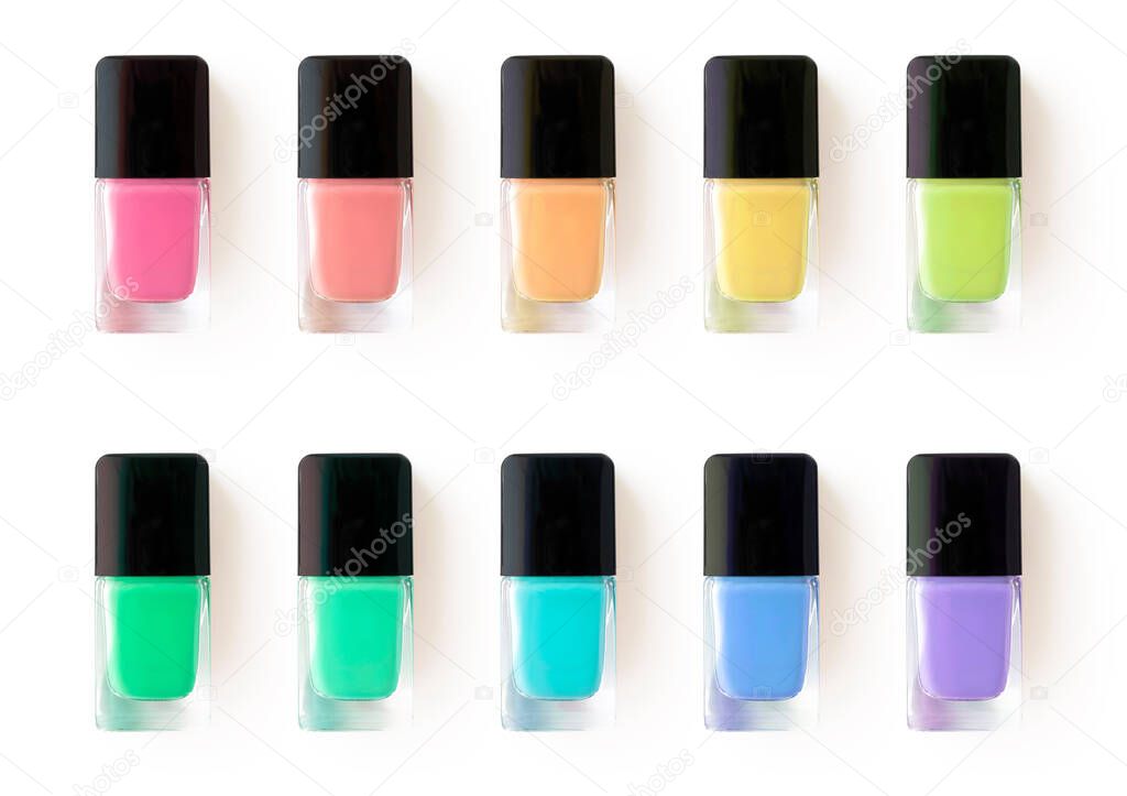 Colorful nail polish in glass bottles isolated on white background. Colors swatch palette. Fashion beauty products for manicure and pedicure