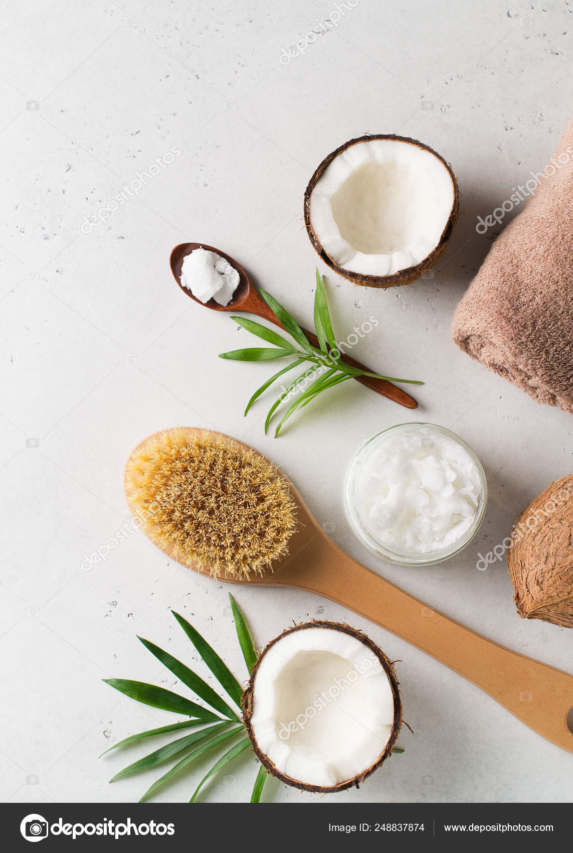 Dry massage brush with coconuts oil, health wellness concept wit Stock