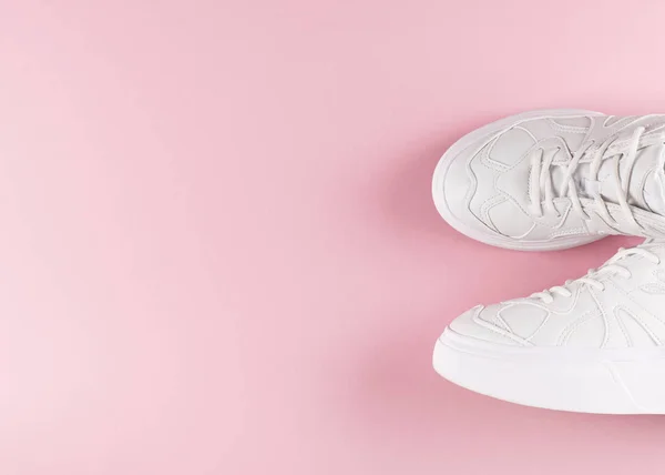 White sneakers flat lay