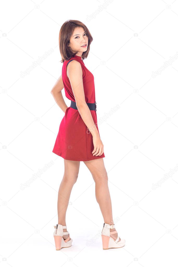 beautiful asian girl in red dress in a studio shot on white background (with selective focus)