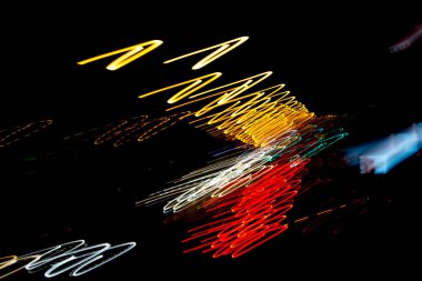 Soyut yaratıcı eğri. Geçmişi. Doku. Siyah arkaplanda soyut ışıklar.