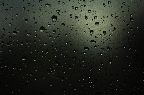 Raindrops on the glass. Raindrops on a sky background. Background. Texture.