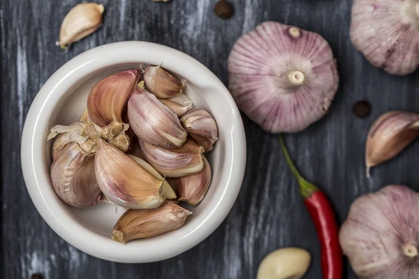 garlic cloves with chili and black pepper