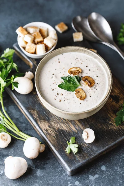 Yummy white mushroom cream soup with champignons on dark table — Stock Image Yummy White Mushroom Cream Soup Champignons Dark Table Royalty Free Stock Photos