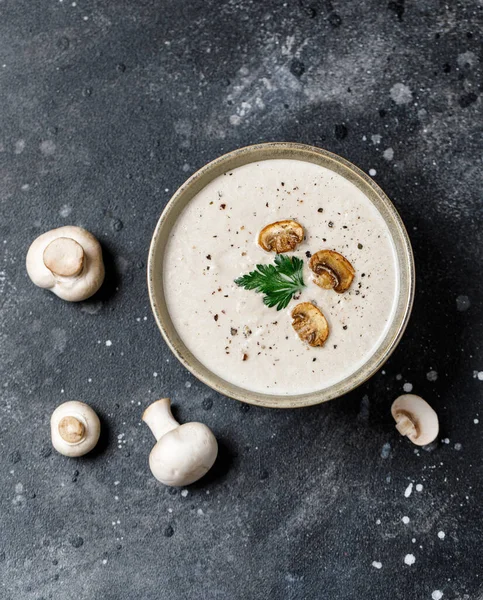 Yummy white mushroom cream soup with champignons on dark table — Stock Image Yummy White Mushroom Cream Soup Champignons Dark Table Royalty Free Stock Images
