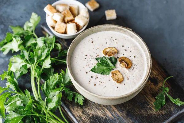 Yummy white mushroom cream soup with champignons on dark table — Stock Image Yummy White Mushroom Cream Soup Champignons Dark Table Stock Image
