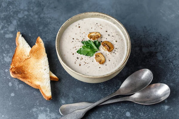 Yummy white mushroom cream soup with champignons on dark table — Stock Image Yummy White Mushroom Cream Soup Champignons Dark Table Royalty Free Stock Images