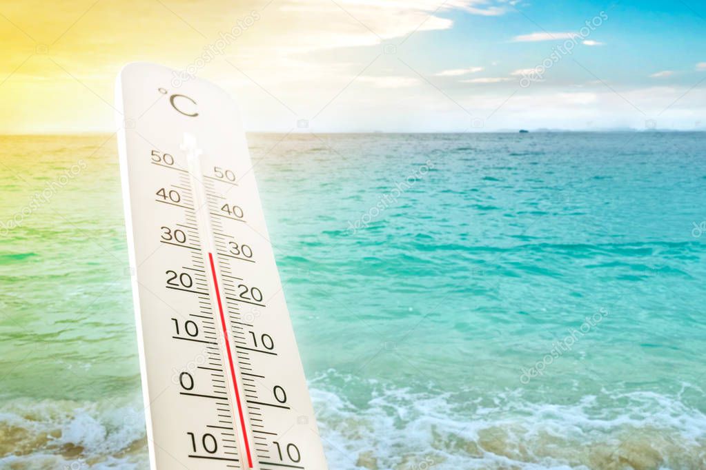 Heat wave on the beach thermometer shows in summer.