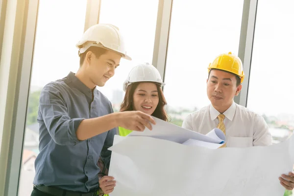 Instructor with young people in engineering training in construction on site work.