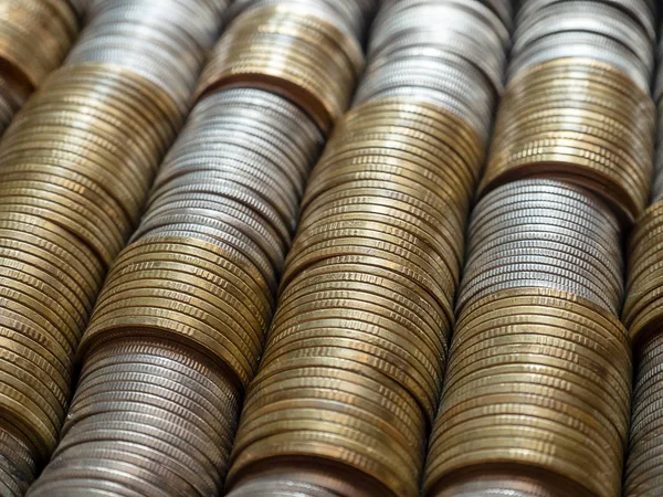 Horizontal row of silver coins and gold coins. Finance saving money and business concept.