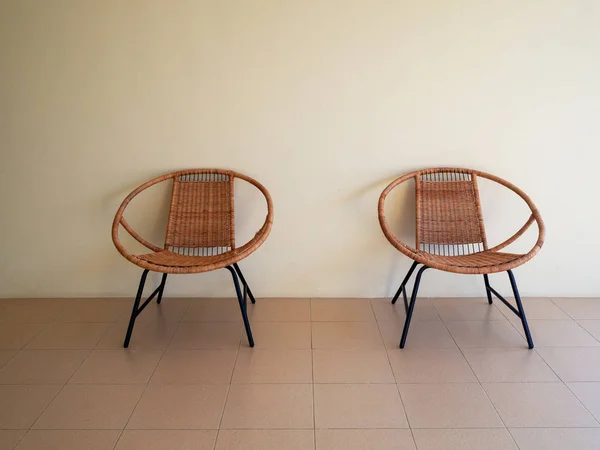 Modern vintage design rattan chairs furniture with white wall backgrounds. Interior design.