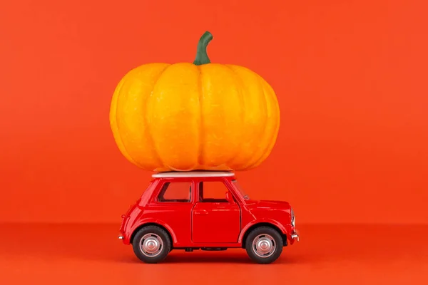 Retro Red Toy Car Pumpkin Roof Red Background Concept Autumn — Stock Photo, Image